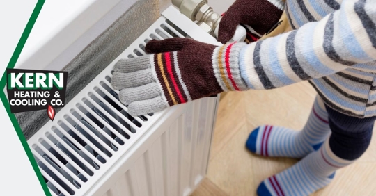 Warming hands on heater.
