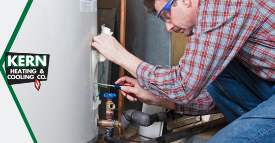 Man fixing a water heater