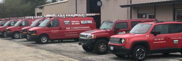 Row of Kern Heating & Cooling Co. Trucks